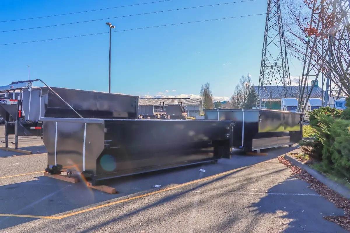 Roll-off dumpster ready for waste disposal at job site for Concrete Dumpster Rental in Saginaw